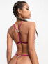 ASOS DESIGN Flutter lace cut-out thong in magenta