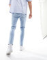 ASOS DESIGN skinny jeans in light wash blue with thigh rip