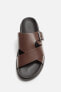 Criss-cross sandals with buckle