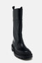 Flat boots with rubberised sole