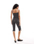 Фото #2 товара ASOS DESIGN spaghetti strap jumpsuit with contrast binding and split hem in mono spot print