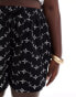 Фото #5 товара ASOS DESIGN Curve broderie shorts with tie pockets in black/white