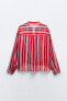 Striped semi-sheer shirt with knot