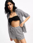 The Frolic bromine beach short co-ord in black and white textured gingham