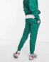 Karl Kani retro patch joggers in green