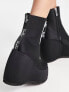 Shellys London – Roxanne – Stiefel in Schwarz mit Keilabsatz
