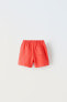 Plush bermuda shorts with label detail