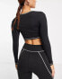 Фото #4 товара South Beach over lock stitch cut out long sleeve top in black