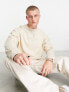 Фото #1 товара ASOS DESIGN oversized sweatshirt in beige with central embroidery