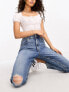 ASOS DESIGN Petite slim fit comfort mom jeans with rip in mid blue