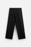 CREASED-EFFECT KNIT TROUSERS