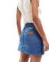 Wrangler mini denim skirt in rinsed blue