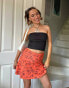 Фото #1 товара Daisy Street X Chloe Davie Y2K flippy mini skirt in retro orange floral