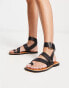 Фото #1 товара ASOS DESIGN Foxy leather studded toe loop flat sandals in black