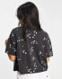 ASOS DESIGN boxy high neck tee in daisy embroidery in washed charcoal