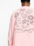 ASOS DESIGN – Locker geschnittene Unisex-Jogginghose in rosa Waschung mit Prints, Kombiteil