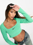Nike Dance mini swoosh long sleeve crop top in spring green