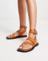 Фото #1 товара ASOS DESIGN Foxy leather studded toe loop flat sandal in tan