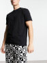 Фото #4 товара ASOS DESIGN pyjama set with t-shirt and trousers in black with fleece printed bottom