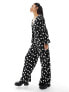 Wednesday's Girl polka dot v-neck jumpsuit in black