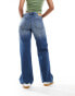 Monki Imoo low waisted wide fit jeans in gabby blue wash with spray