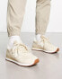 New Balance 574 trainers in beige