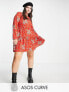 Фото #1 товара ASOS DESIGN Curve long sleeve tiered smock mini dress in red floral print