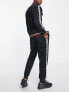 Umbro Global tricot tracksuit in black and white