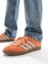 adidas Originals Gazelle Indoor trainers in orange and mint