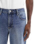 ASOS DESIGN tapered fit jeans in noughties blue wash