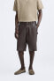 Leather carpenter bermuda shorts with pocket