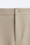 Wide-fit pleated trousers