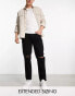 ASOS DESIGN tapered fit jeans in black wash with knee rips - BLACK