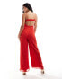 ASOS DESIGN raw edge corset panelled jumpsuit with cut out in red