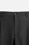 RELAXED FIT PLEATED TROUSERS