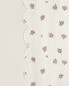 Scalloped edge floral curtain