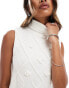 In The Style cable knit sleeveless roll neck tassel hem jumper in cream