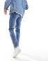 ASOS DESIGN skinny jeans with knee rip in dark wash blue