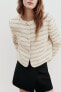 Short jacket with shoulder pads