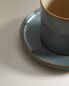 Teacup and saucer with contrast rim