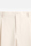 RELAXED FIT PLEATED TROUSERS