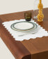 Embroidered linen placemat