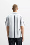 ELASTIC SHIRT WITH STRIPED PRINT