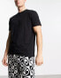 ASOS DESIGN pyjama set with t-shirt and trousers in black with fleece printed bottom Черный, S - W32 - фото #4