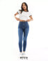 Фото #1 товара Bershka Petite high waist skinny jean in mid blue