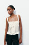 Embroidered ruffled top