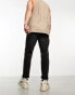 ASOS DESIGN tapered jeans in washed black