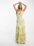 ASOS DESIGN knot front cut out maxi slip dress with raw edge tiers in yellow floral print