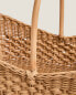 Woven rattan basket with handle
