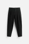 TEXTURED PLEATED TROUSERS